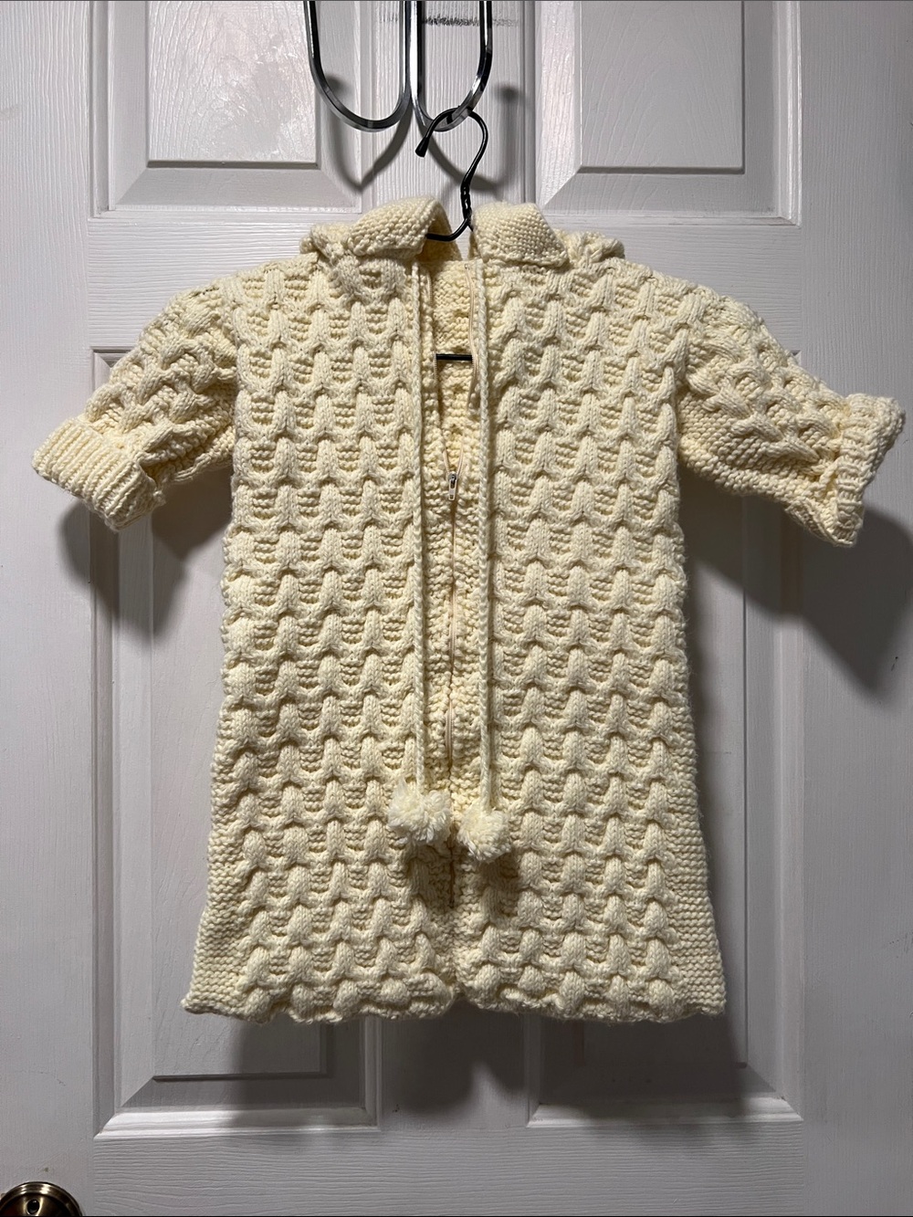 Cozy Cream Knit Baby Cape with Pom Tie